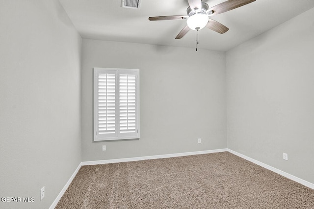 empty room featuring carpet and ceiling fan