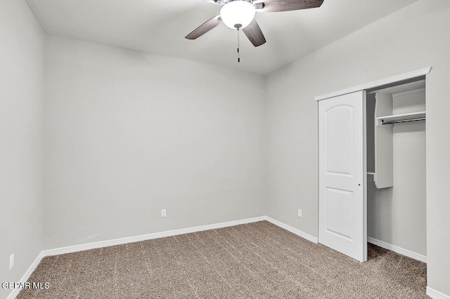 unfurnished bedroom featuring carpet flooring, a closet, and ceiling fan