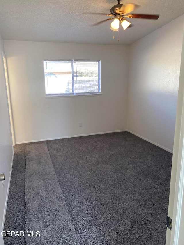 carpeted empty room featuring a textured ceiling and ceiling fan