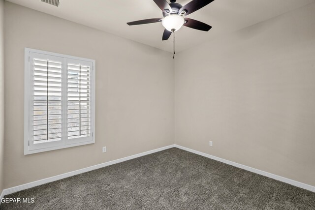 empty room featuring carpet and ceiling fan