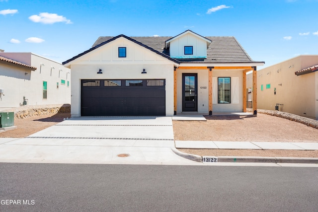 modern farmhouse with central AC unit and a garage