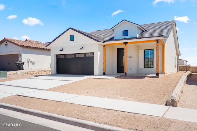 modern inspired farmhouse with a garage