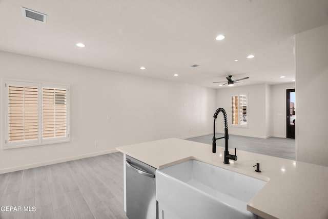 13870 Paseo Central Ave, Horizon City, TX 79928 - kitchen with a sink, dishwasher, recessed lighting, ceiling fan, and light countertops