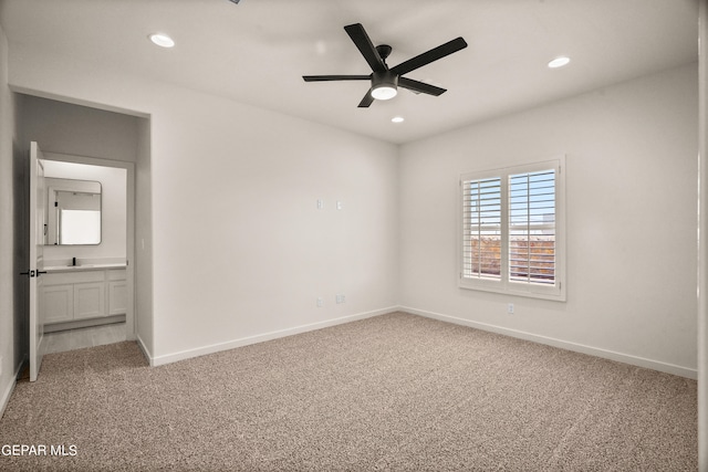 carpeted empty room with ceiling fan