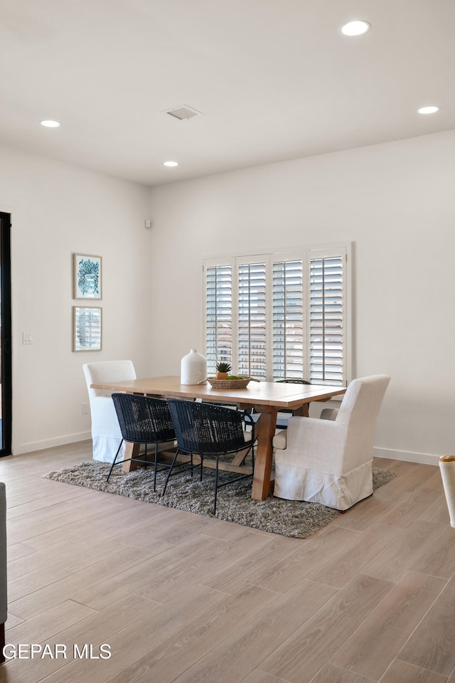 dining room featuring light hardwood / wood-style floors