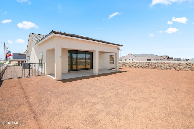 back of house featuring a patio