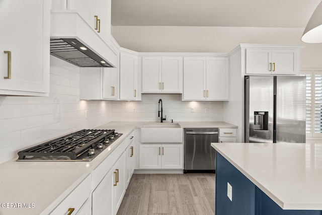 kitchen featuring white cabinetry, light hardwood / wood-style flooring, stainless steel appliances, and sink