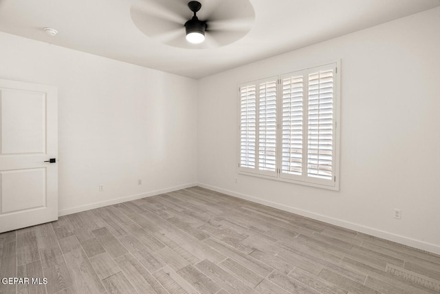 unfurnished room featuring ceiling fan and light wood-type flooring