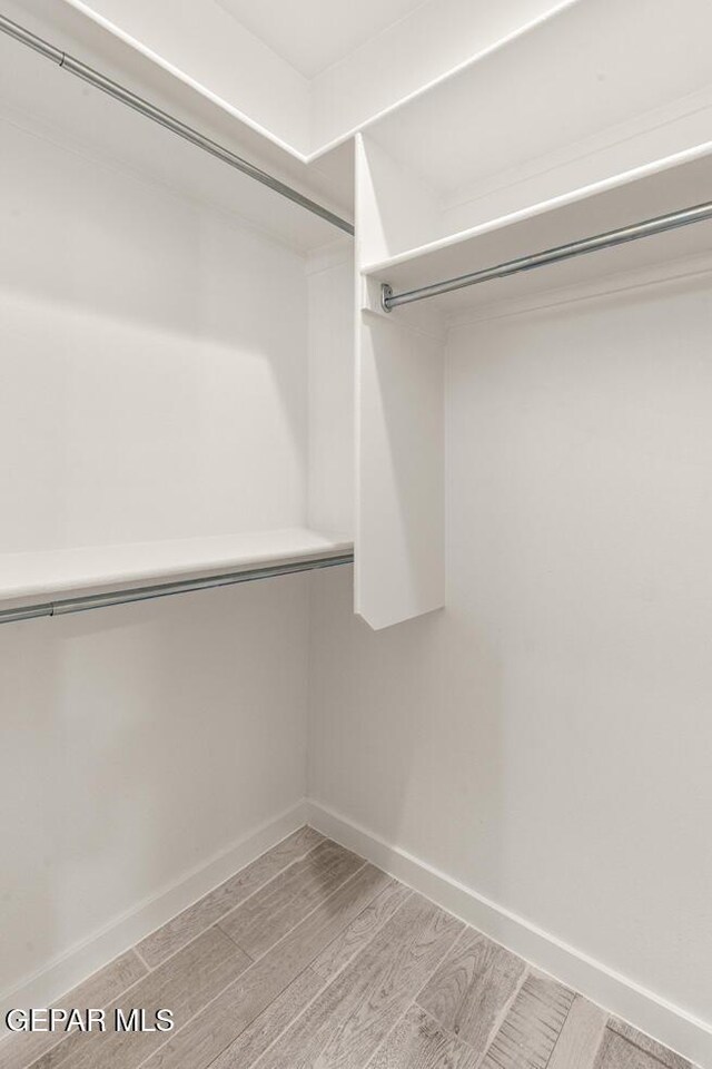 14960 Hill Ridge Ct, El Paso, TX 79938 - spacious closet featuring wood finished floors