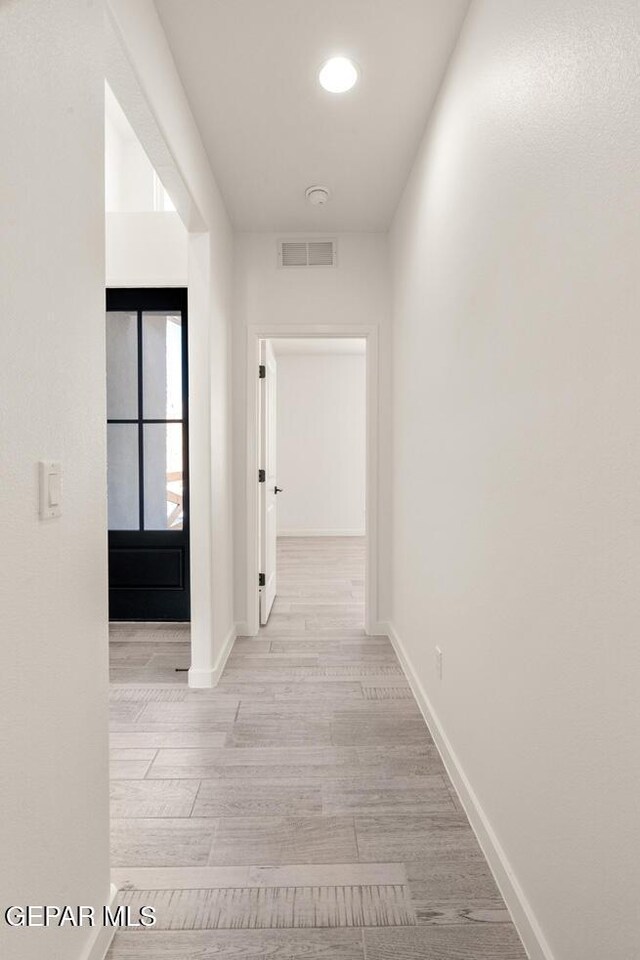 14960 Hill Ridge Ct, El Paso, TX 79938 - hallway featuring wood finished floors and baseboards