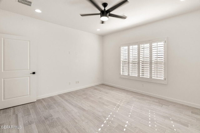 empty room with light wood-type flooring and ceiling fan