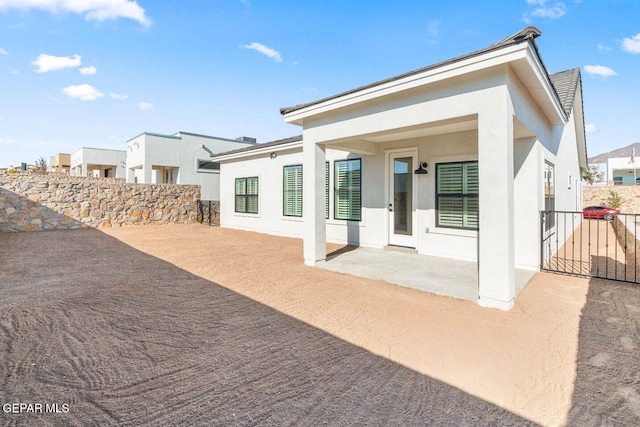 rear view of house with a patio