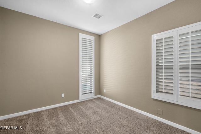 empty room featuring carpet floors