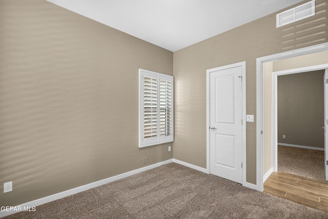 unfurnished bedroom with hardwood / wood-style flooring