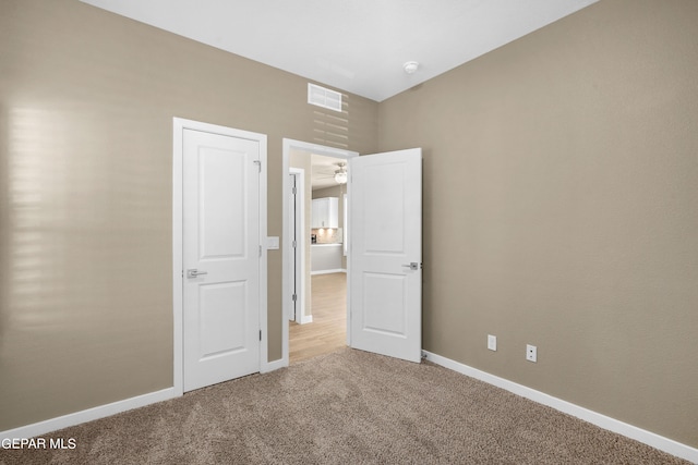 unfurnished bedroom featuring carpet floors