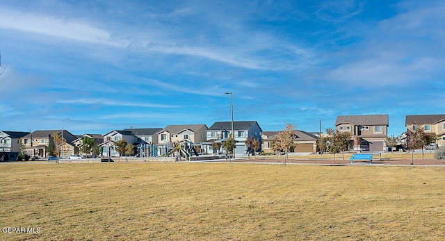 view of home's community with a yard and a garage