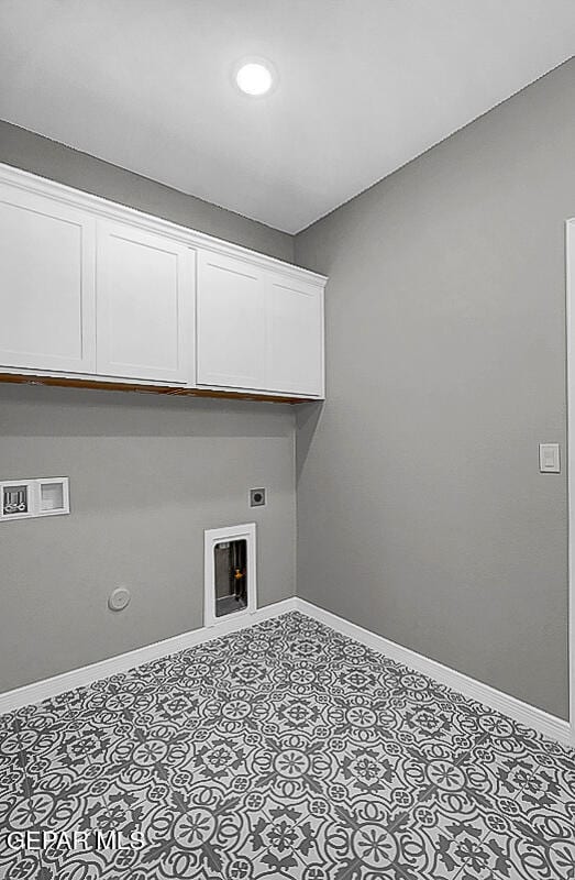 laundry room featuring hookup for a washing machine, electric dryer hookup, cabinets, and gas dryer hookup