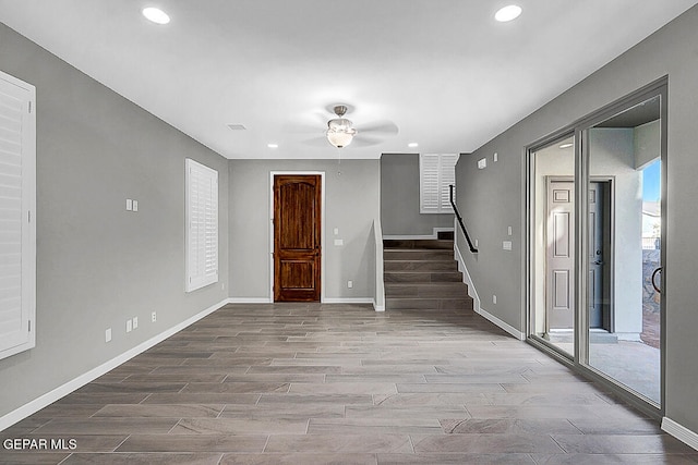 foyer entrance featuring hardwood / wood-style floors and ceiling fan