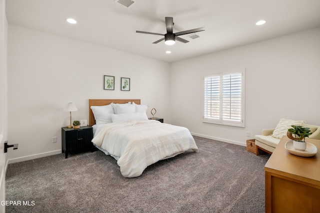 bedroom with ceiling fan and dark colored carpet