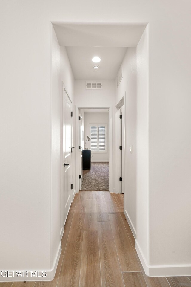 14956 Hill Ridge Ct, El Paso, TX 79938 - corridor featuring wood finished floors and baseboards