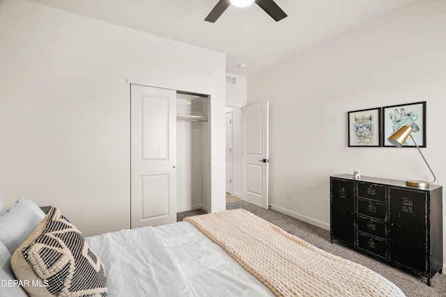 carpeted bedroom featuring a closet and ceiling fan