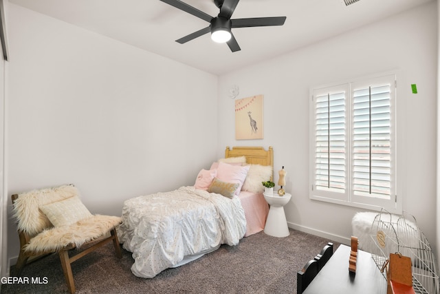 bedroom with ceiling fan, carpet, and multiple windows