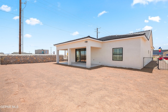 back of property with a patio area