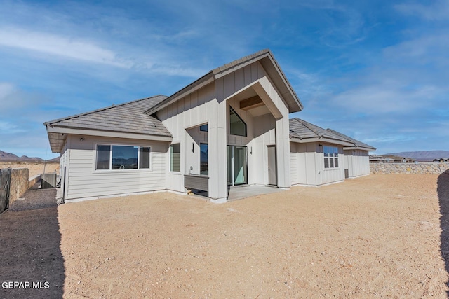 rear view of property with a mountain view