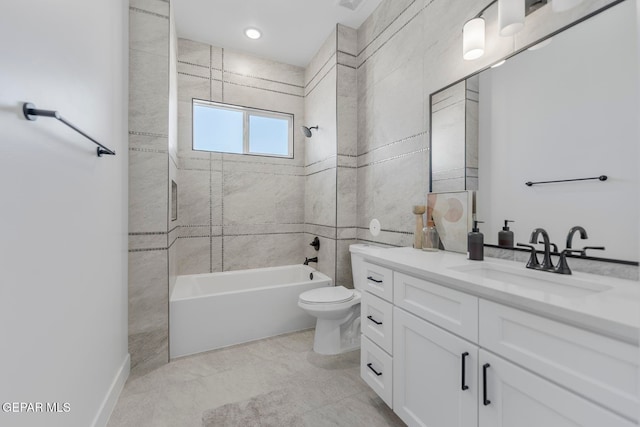 full bathroom featuring vanity, tiled shower / bath combo, and toilet