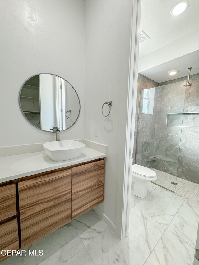 1783 Urijah Pl, El Paso, TX 79928 - full bath with marble finish flooring, vanity, a marble finish shower, toilet, and baseboards