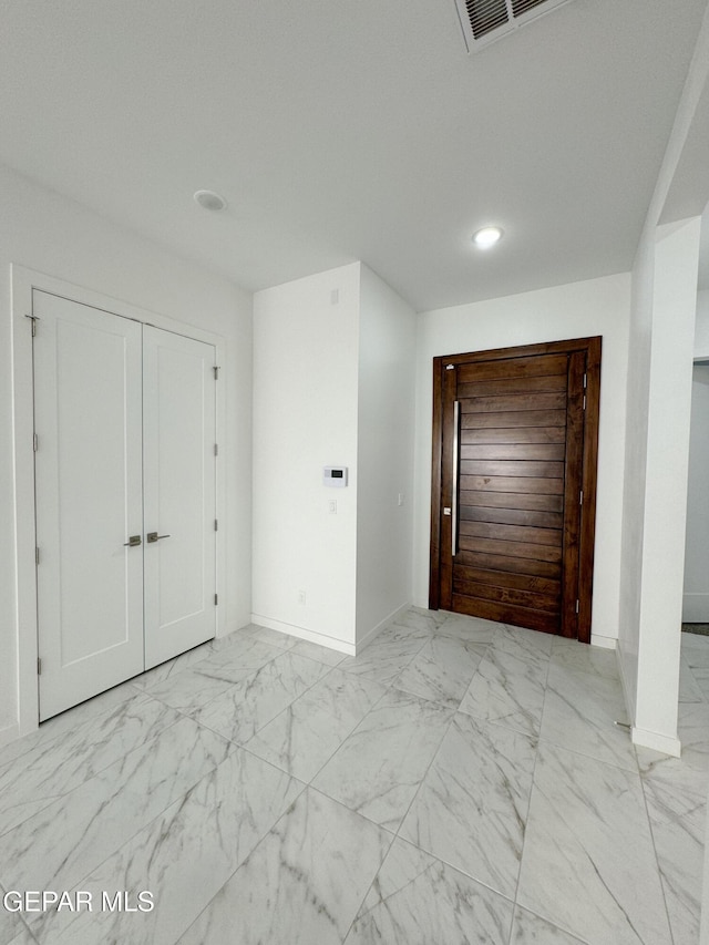 1783 Urijah Pl, El Paso, TX 79928 - unfurnished bedroom with light marble finish floors, baseboards, a closet, and recessed lighting