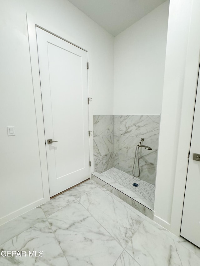 1783 Urijah Pl, El Paso, TX 79928 - bathroom featuring marble look tiles and baseboards