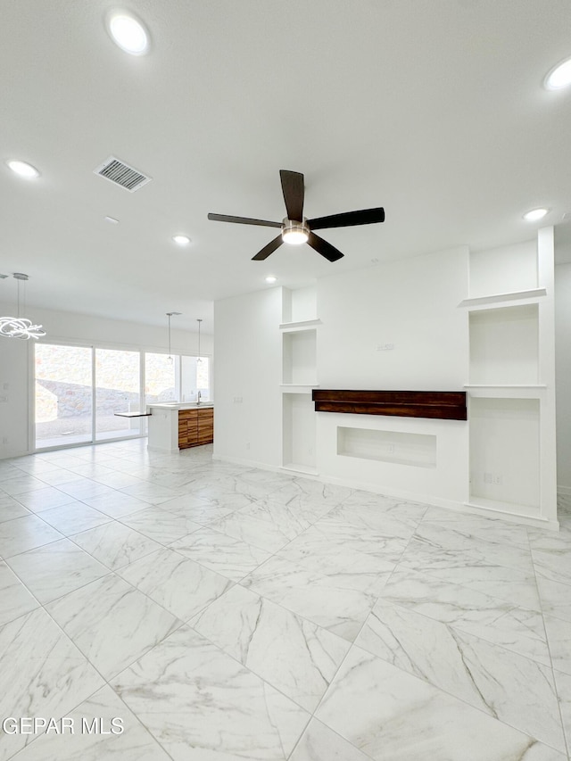 1783 Urijah Pl, El Paso, TX 79928 - unfurnished room featuring built in shelves, recessed lighting, ceiling fan, and light marble finish flooring