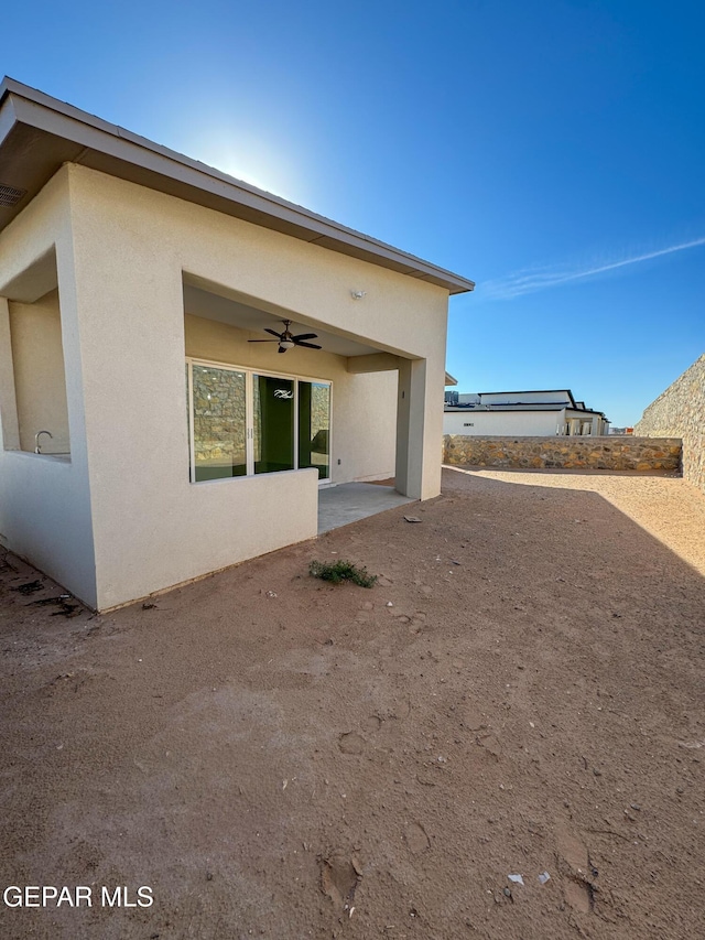 1783 Urijah Pl, El Paso, TX 79928 - back of property with a ceiling fan, a patio area, and stucco siding