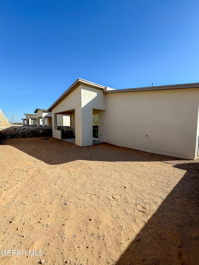 1783 Urijah Pl, El Paso, TX 79928 - rear view of property featuring stucco siding and a patio