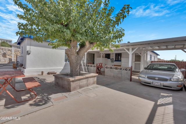 view of patio featuring a carport