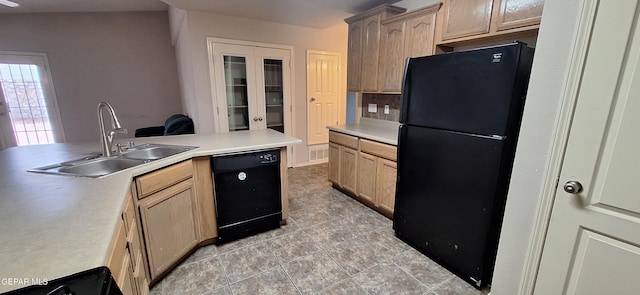 kitchen with light tile patterned flooring, sink, black appliances, tasteful backsplash, and light brown cabinetry