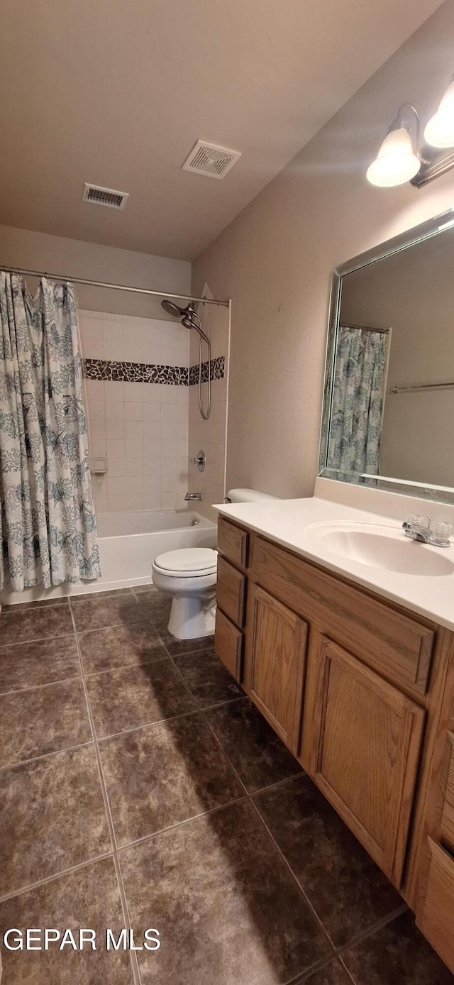 full bathroom with tile patterned floors, vanity, shower / bathtub combination with curtain, and toilet