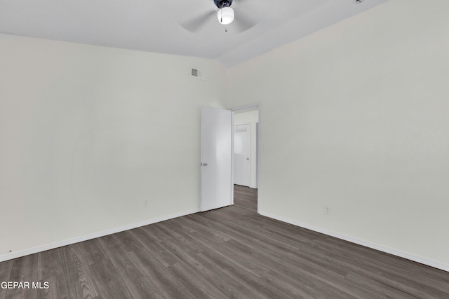 unfurnished room featuring dark wood-type flooring, ceiling fan, and high vaulted ceiling