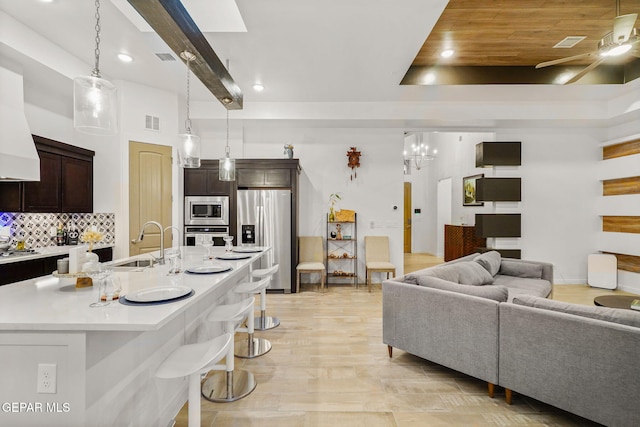 2300 Tierra Zaria, El Paso, TX 79938 - living room with a ceiling fan, recessed lighting, light wood-style flooring, and a chandelier