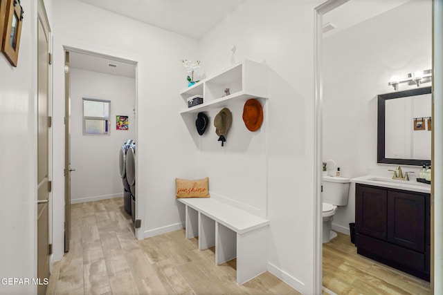 2300 Tierra Zaria, El Paso, TX 79938 - mudroom with washing machine and dryer and light wood finished floors