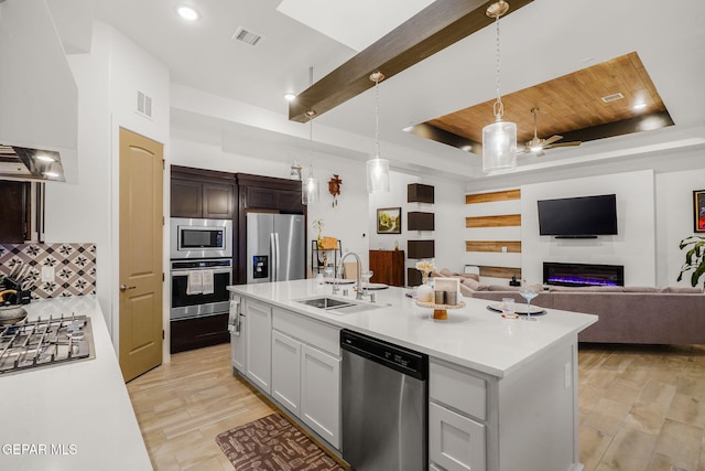 2300 Tierra Zaria, El Paso, TX 79938 - kitchen featuring stainless steel appliances, custom exhaust hood, light countertops, a tray ceiling, and open floor plan