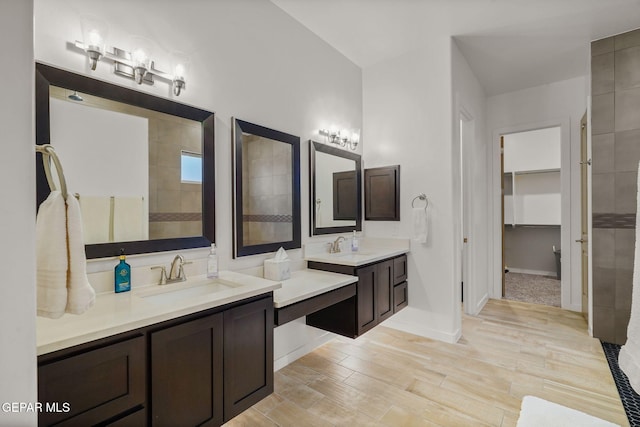 2300 Tierra Zaria, El Paso, TX 79938 - full bathroom featuring two vanities, wood finished floors, and a spacious closet