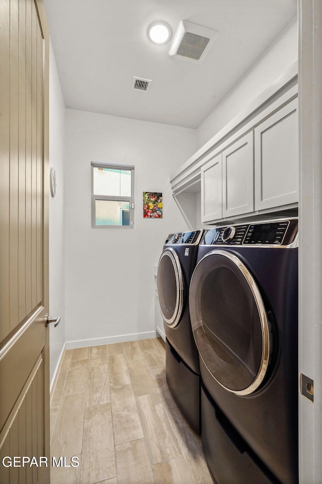 2300 Tierra Zaria, El Paso, TX 79938 - laundry area with separate washer and dryer and cabinet space
