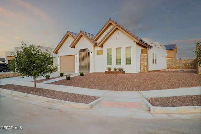 2300 Tierra Zaria, El Paso, TX 79938 - view of front of property with stucco siding, a garage, concrete driveway, and a tiled roof