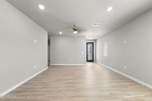 unfurnished room featuring light hardwood / wood-style flooring and ceiling fan