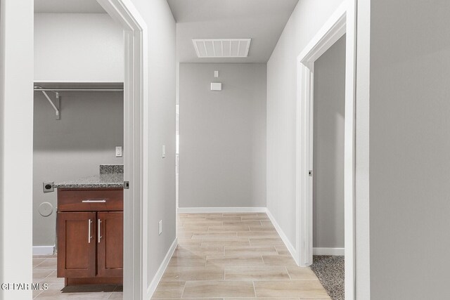 hallway featuring light hardwood / wood-style flooring