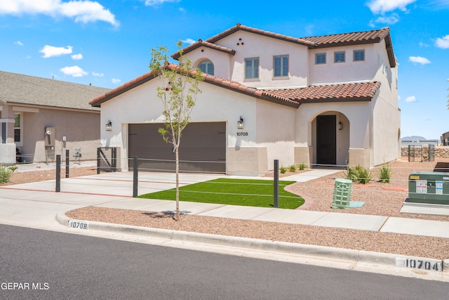 mediterranean / spanish house with a garage