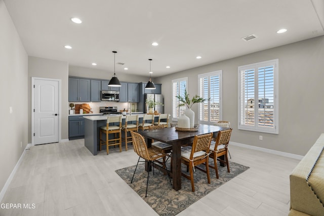 dining area with light wood-type flooring