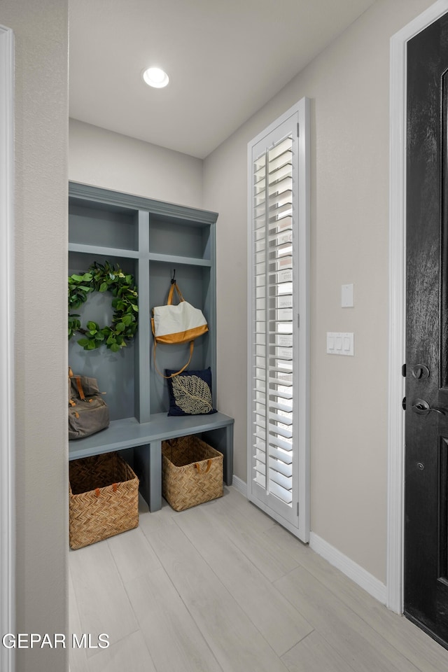 mudroom with hardwood / wood-style floors